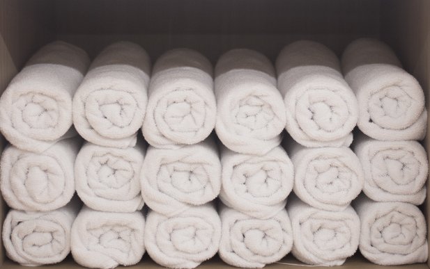 Rolled towels stacked in a pile
