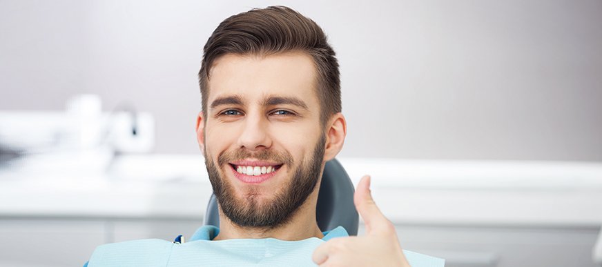 Man smiling in dental exam chair