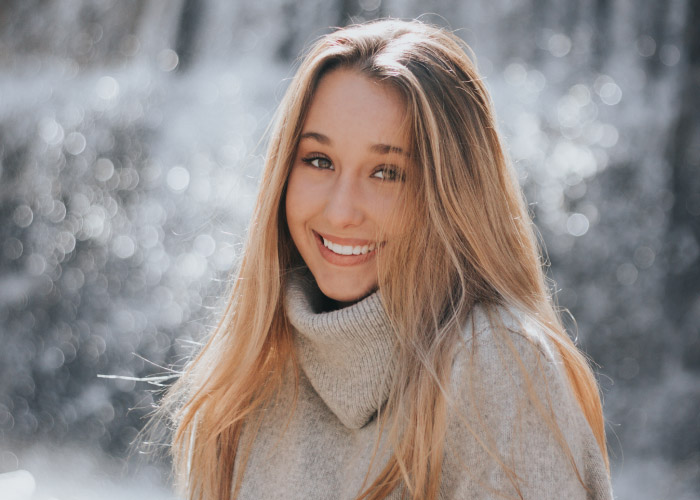 lady smiling after invisalign treatment