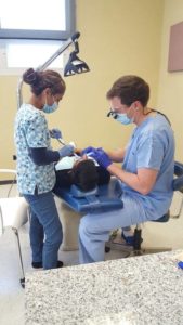 Dr. Moos and a Prairie Dental team member work not the teeth of a patient in Puebla, Mexico