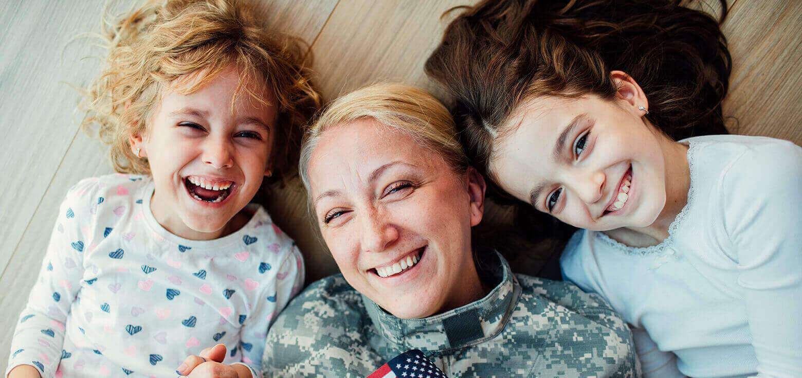army mother smiling with children
