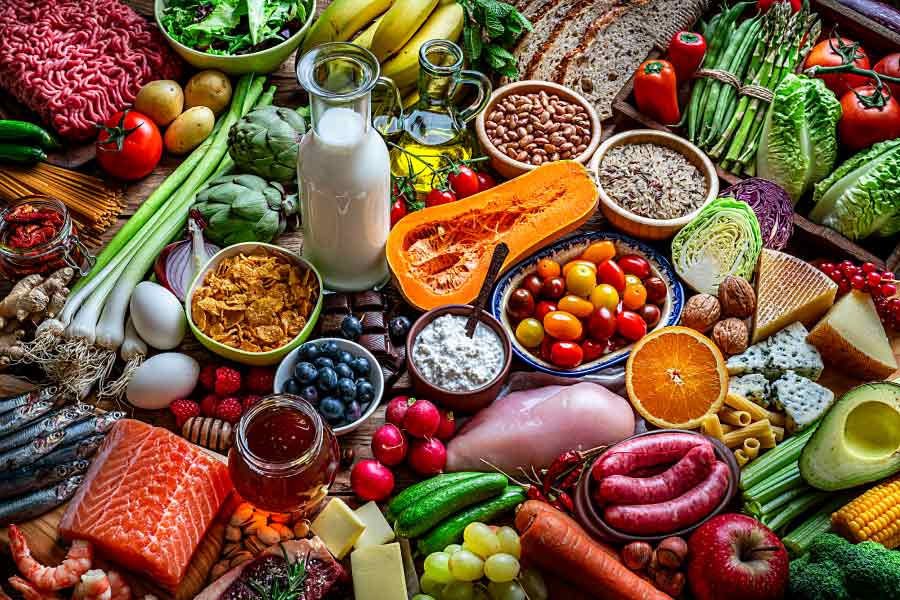 Variety of colorful and healthy foods on a table.