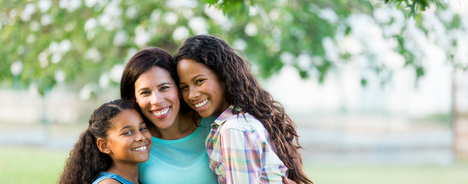 happy mother with her two daughters