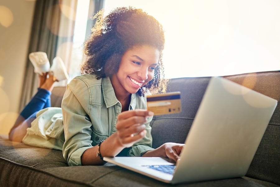 woman paying dental bills with a dental membership plan
